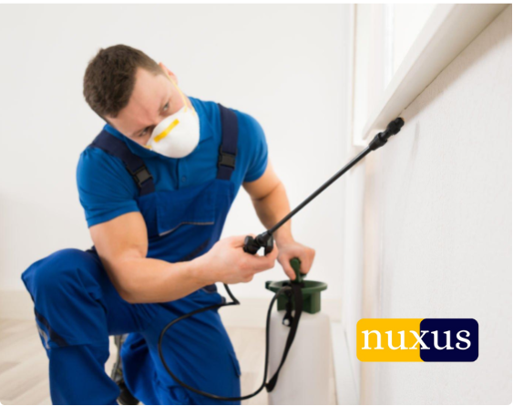 Nuxus Pest Control technicians preparing equipment